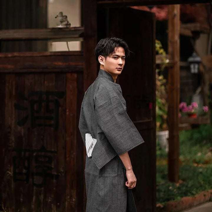 man wearing dark grey kimono