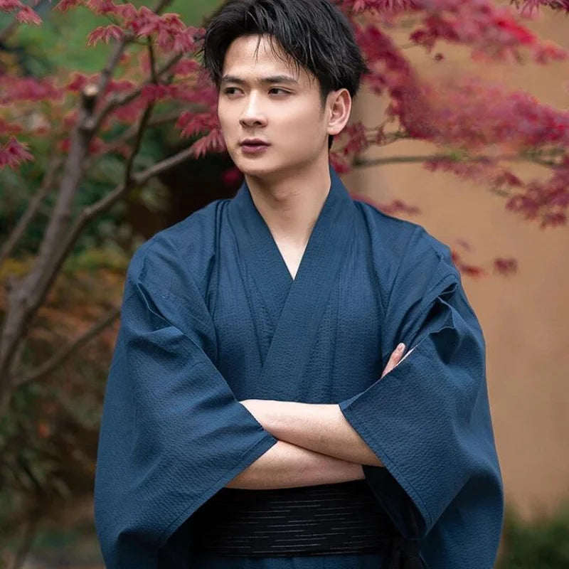 man wearing navy blue kimono