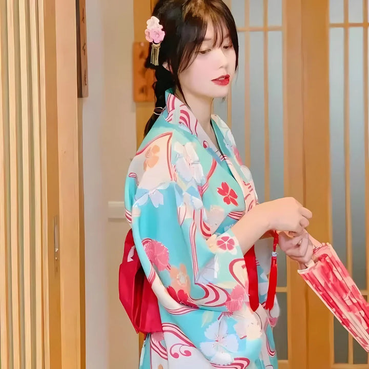 happy girl wearing a blue japanese kimono