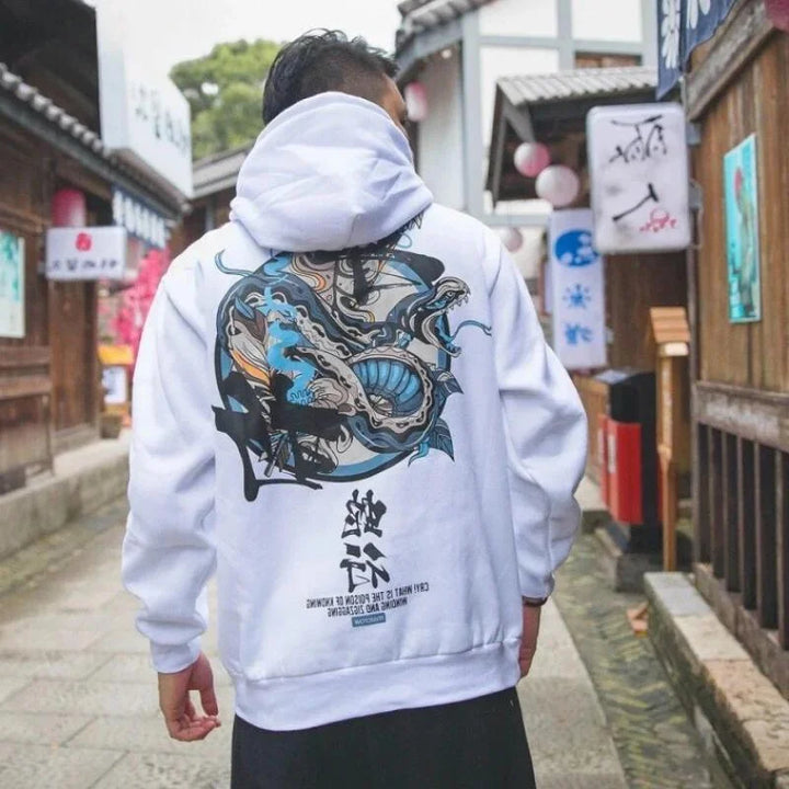 man wearing white hoodie with dragon