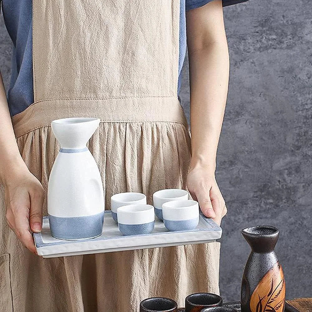 woman holding a sake cups set