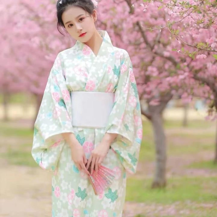 shy woman wearing green floral kimono robe