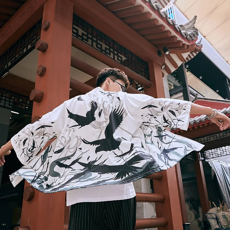 man wearing bird print kimono jackets