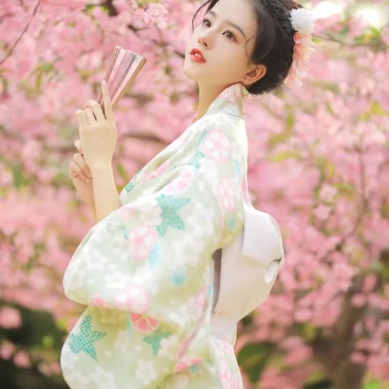 thinking woman with a green floral japanese kimono robe