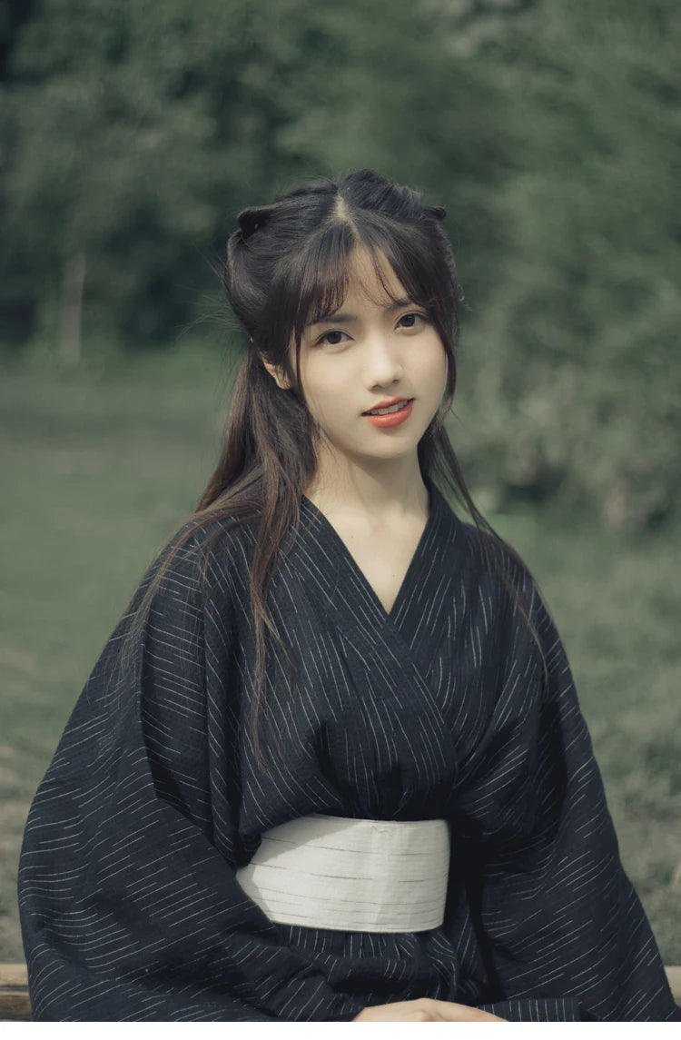 smiling japanese woman with a traditional womens kimono