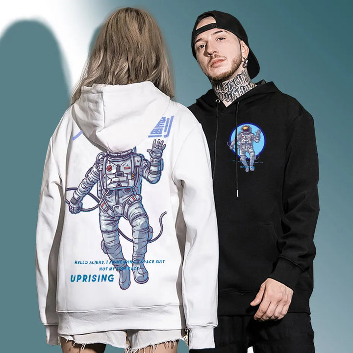 man and japanese woman wearing astronaut hoodies