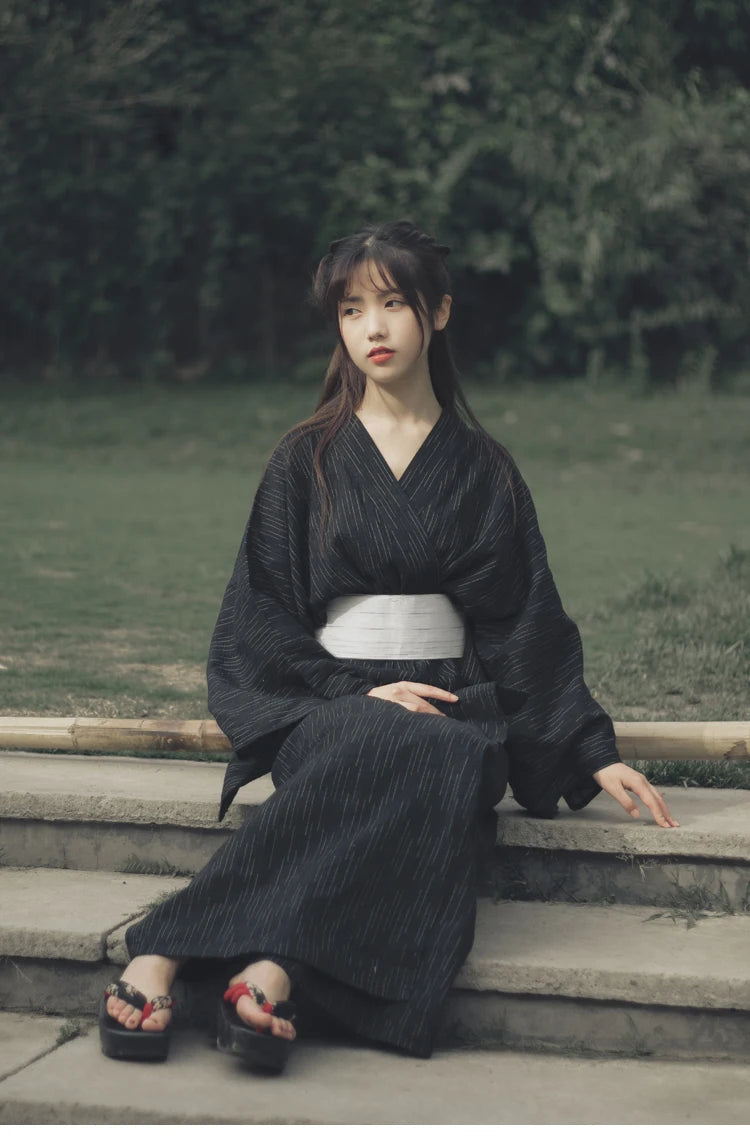 sitted woman with a traditional womens kimono