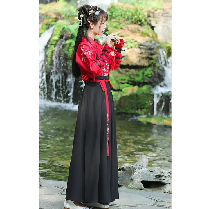 woman wearing embroidered silk kimono robe