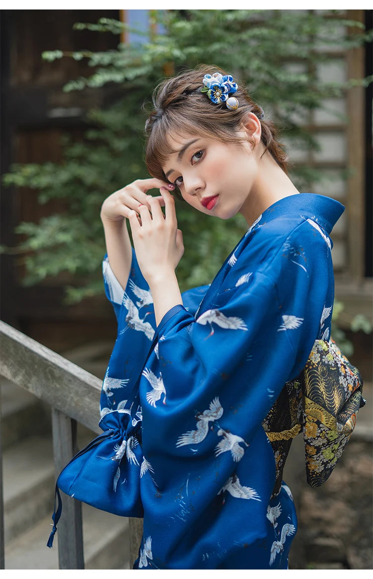 happy girl with a kimono with cranes