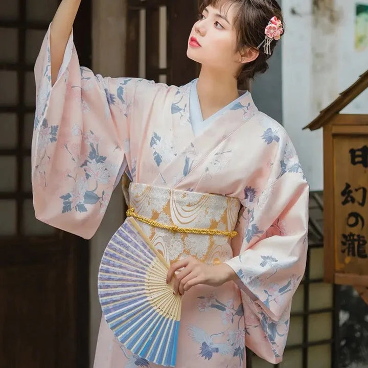 japanese woman wearing a pink kimono robe