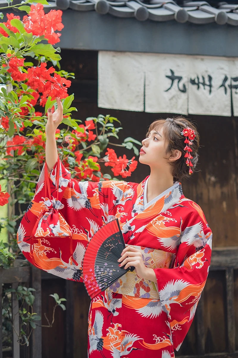 happy japanese girl wearing kimono crane