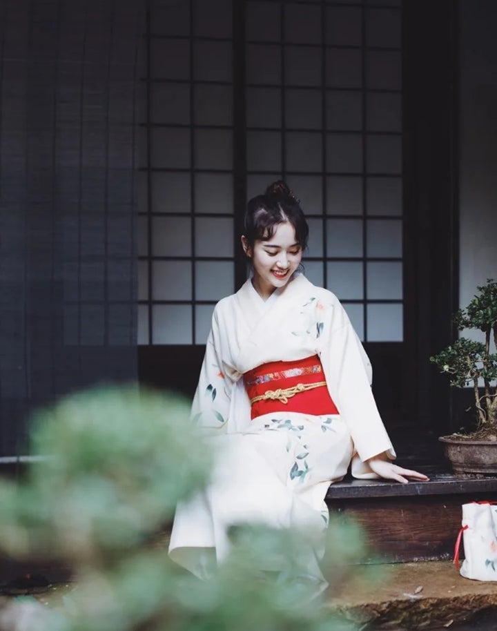 sitted woman with a white linen japanese kimono