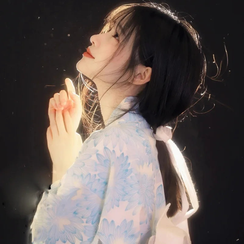 praying woman with japanese blue floral kimono robe