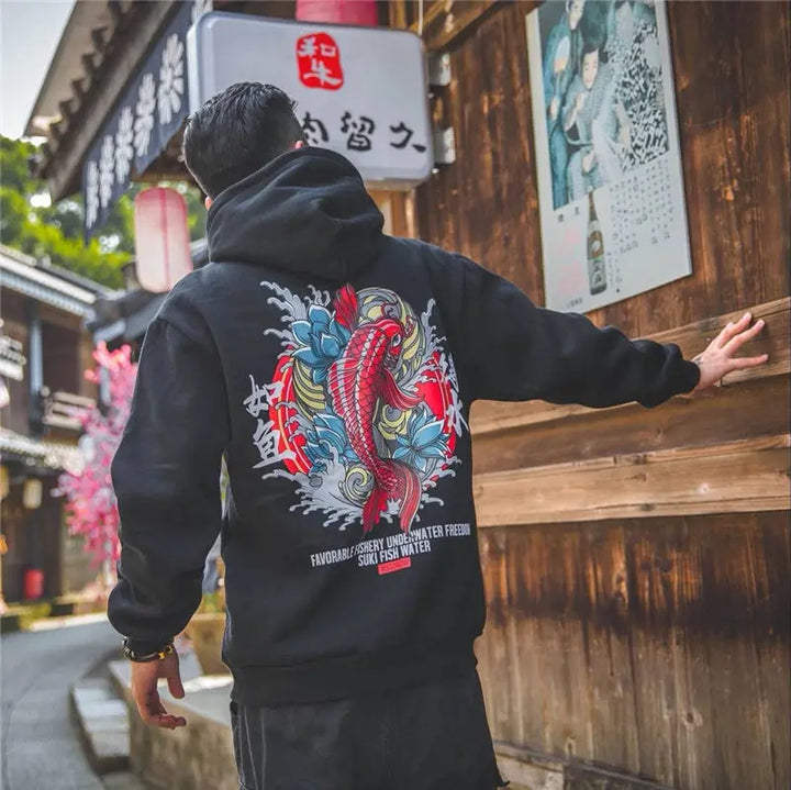 man wearing black koi fish hoodie in japan