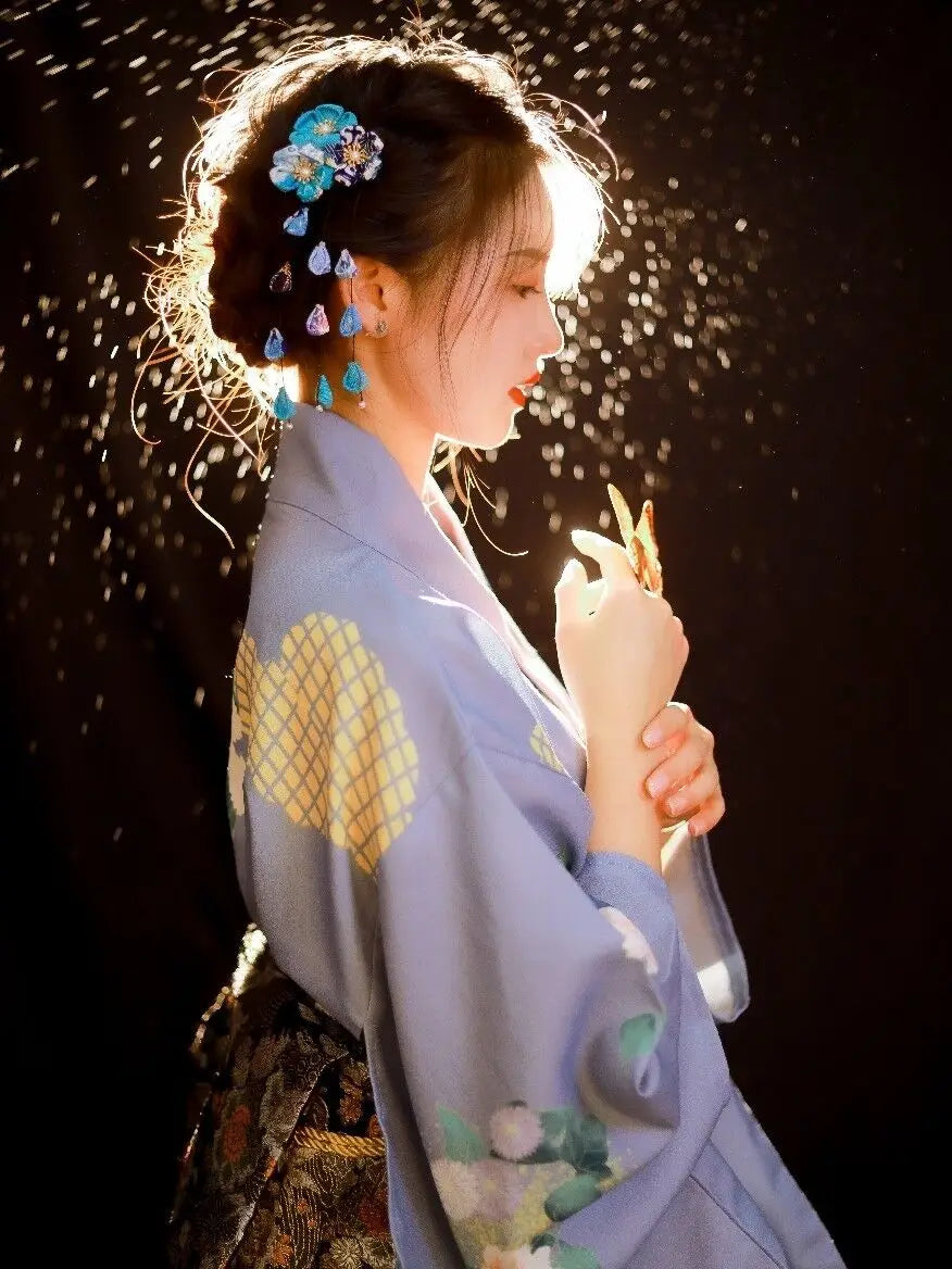 shy woman wearing blue silk kimono robe