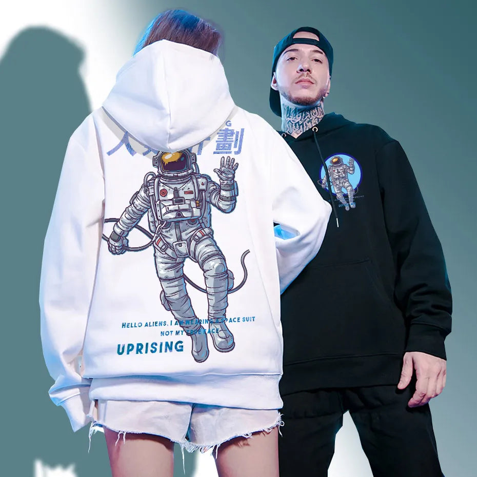 man adn woman wearing astronaut hoodie