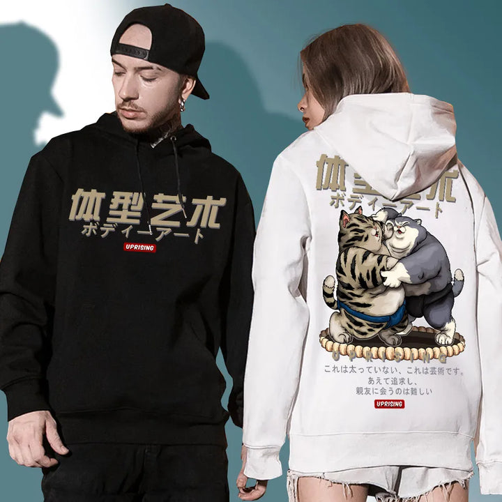 man and woman wearing sumo hoodies