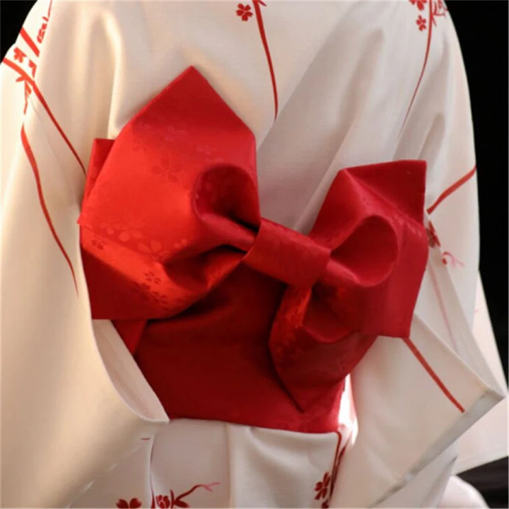 red bowtie on white kimono robe