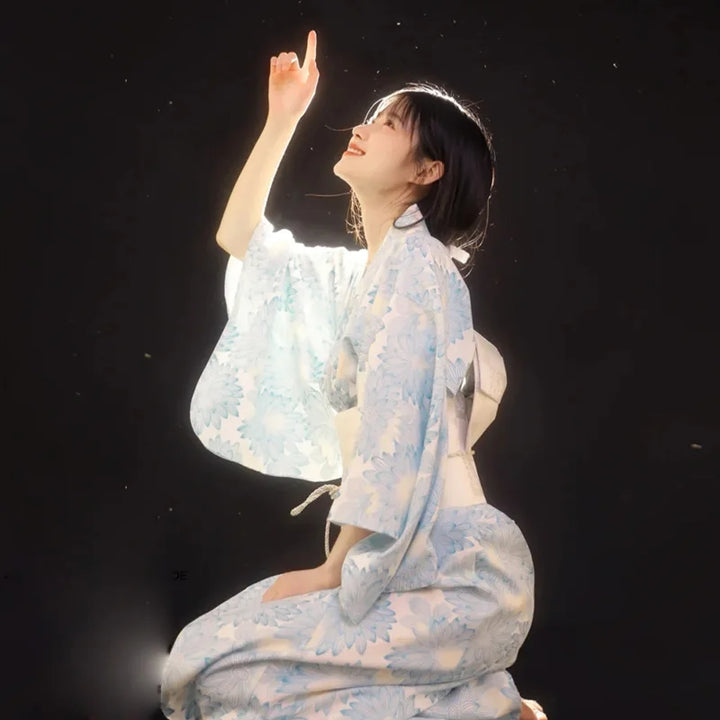 happy woman with a blue floral kimono robe