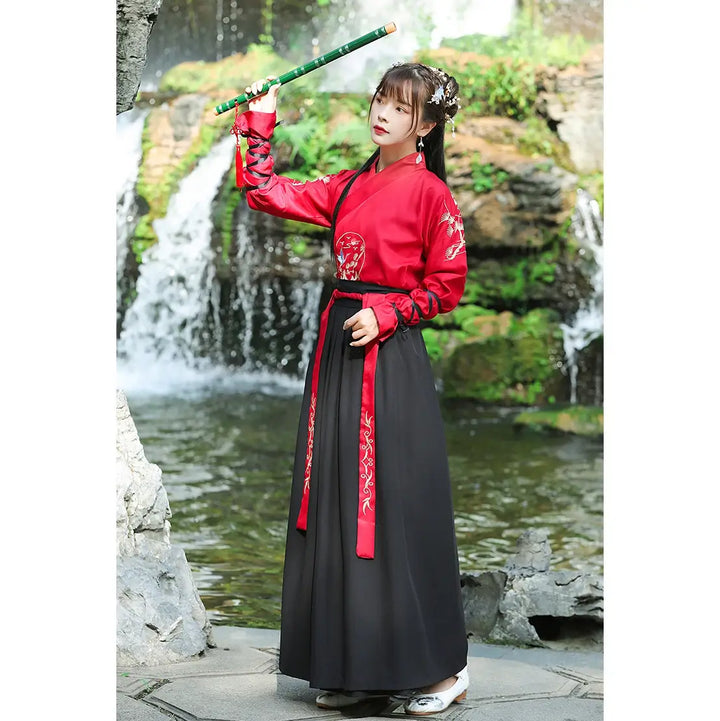 japanese woman wearing embroidered kimono robe