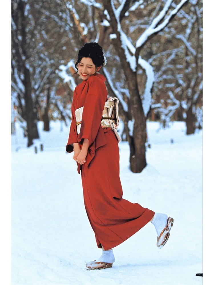 happy woman wearing red silk kimono