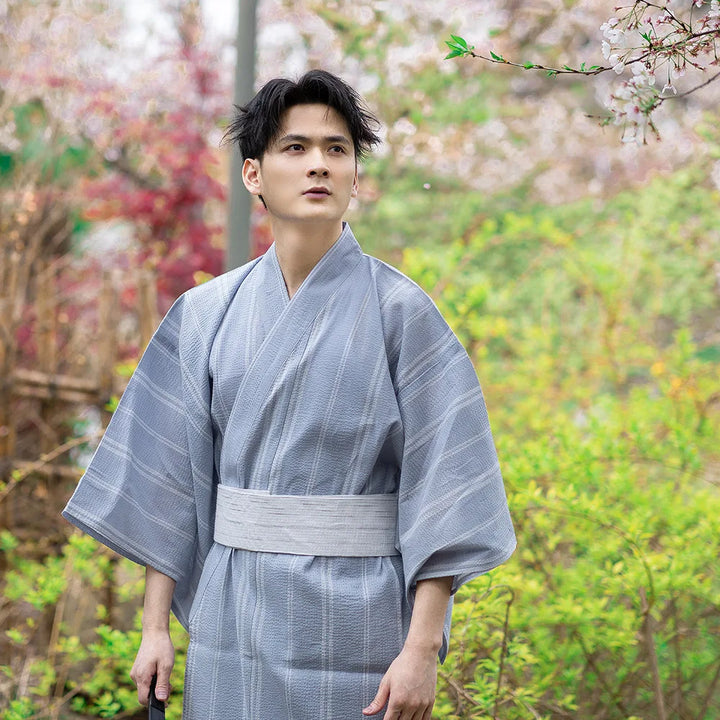 man wearing light blue kimono