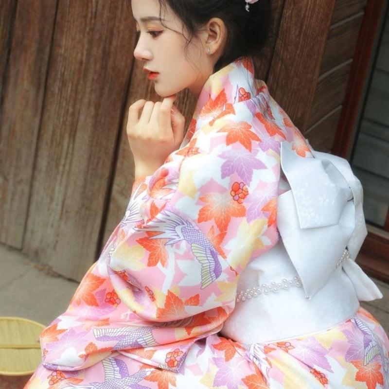 sitted japanese woman with a kimono floral