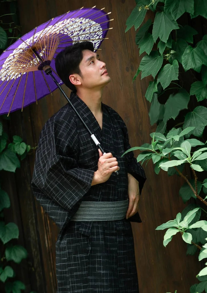 man wearing black kimono 