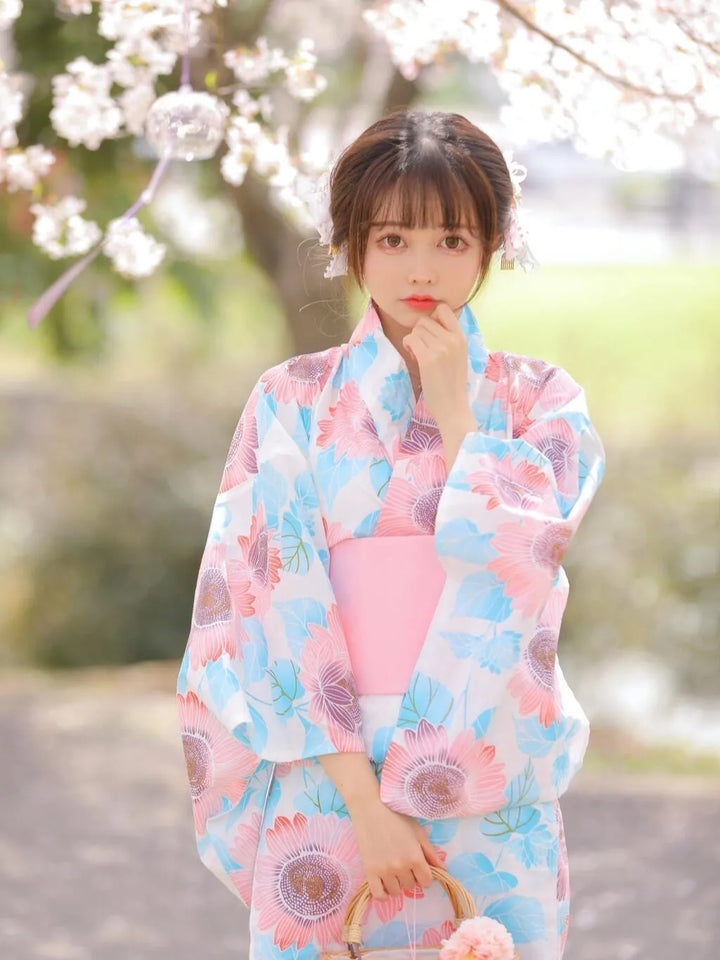 thinking woman with a pink and blue kimono