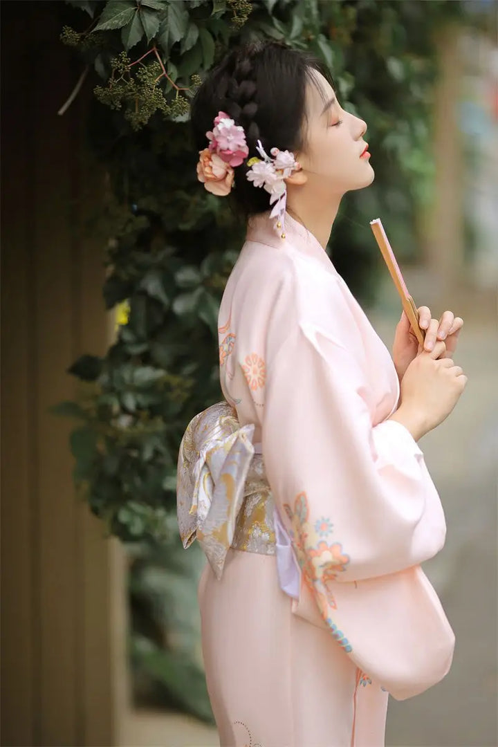 thinking woman with light pink japanese kimono