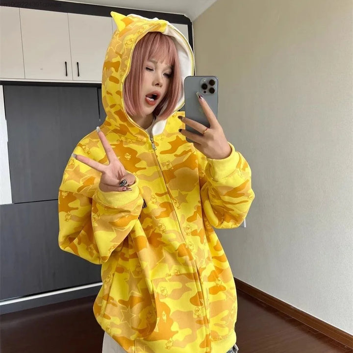 woman wearing yellow hello kitty hoodie with ears