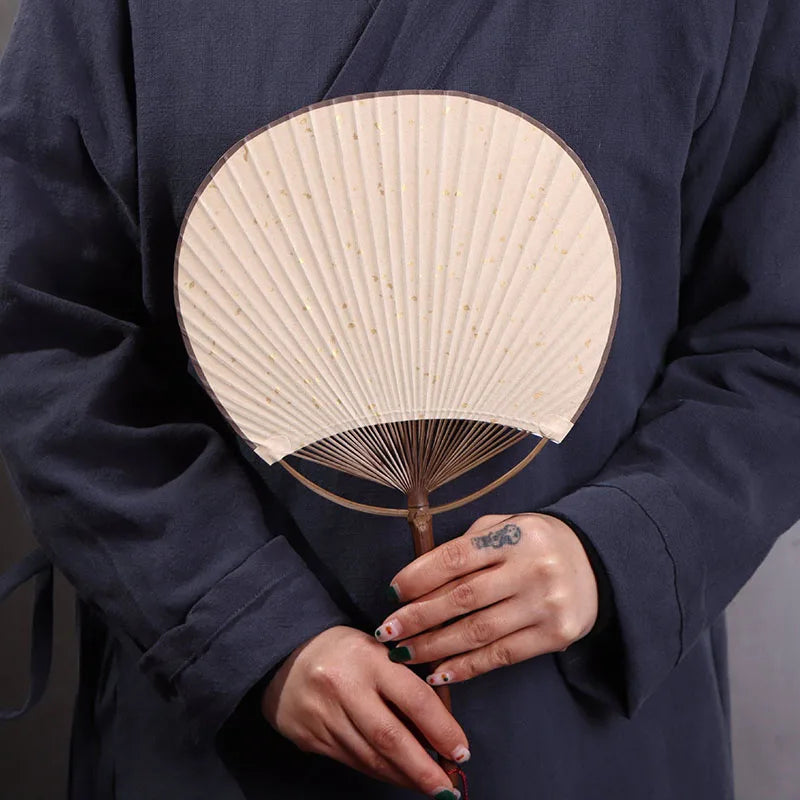 man holding a antique japanese fan