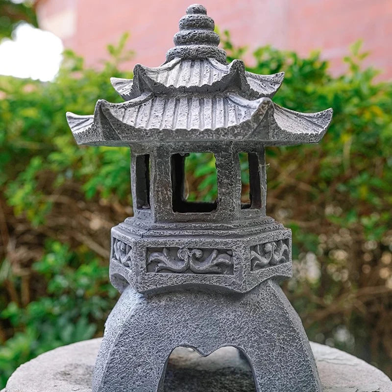 japanese stone pagoda lantern in a garden