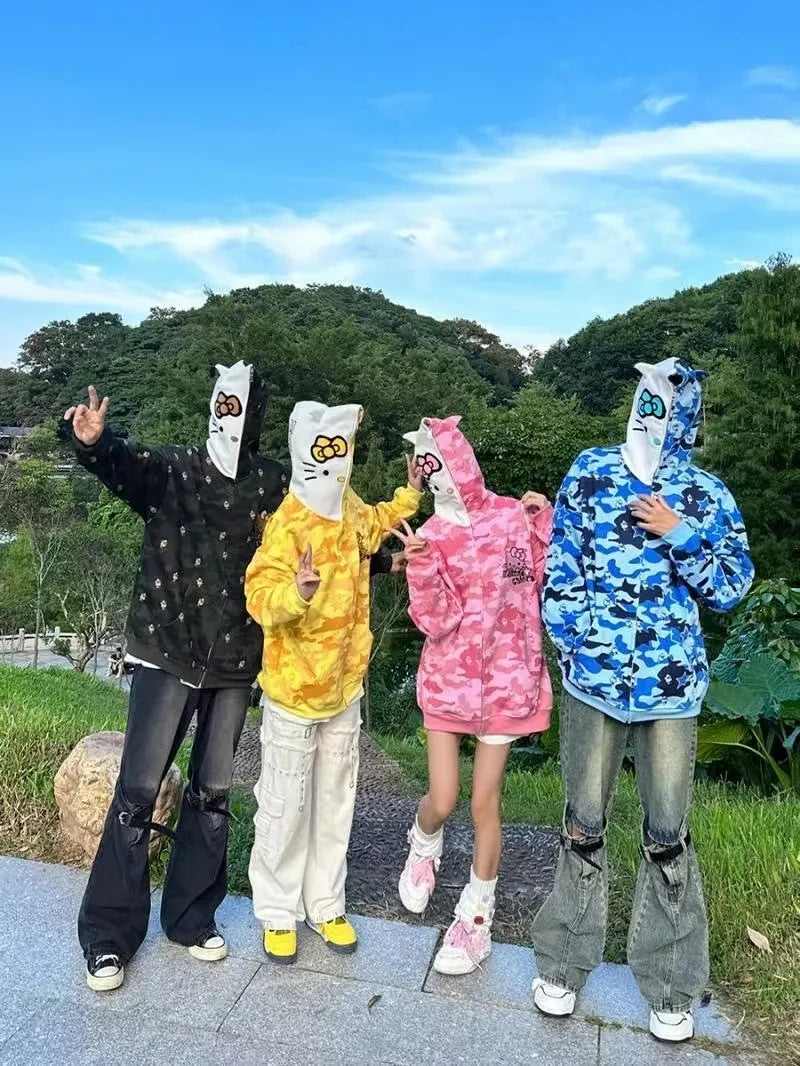 group of people wearing hello kitty hoodies with ears