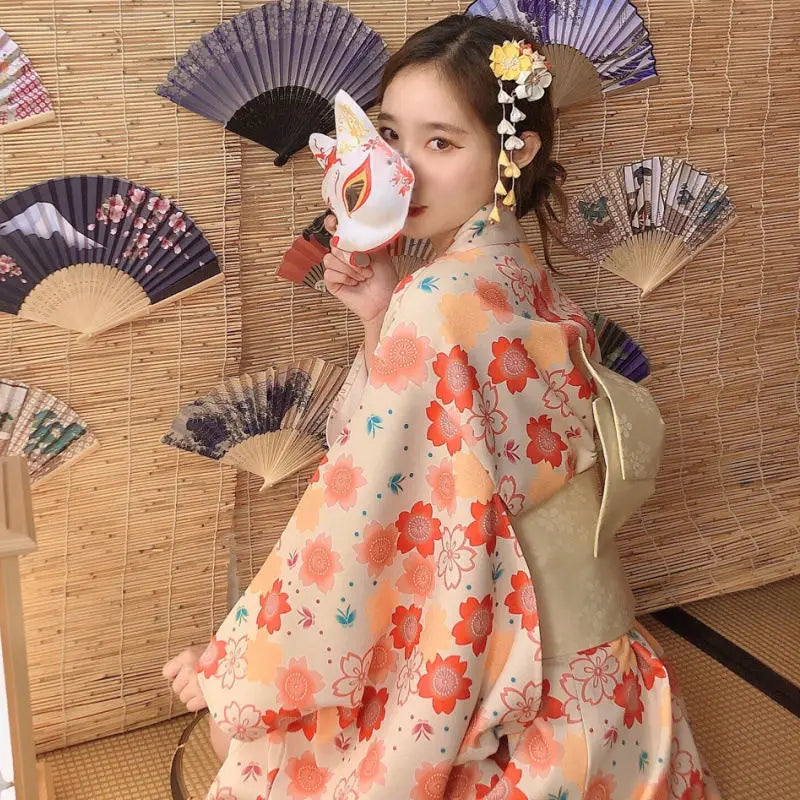 sitted woman with a floral kimono dress