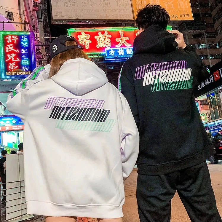 back of man and woman wearing streetwear japanese retro hoodie