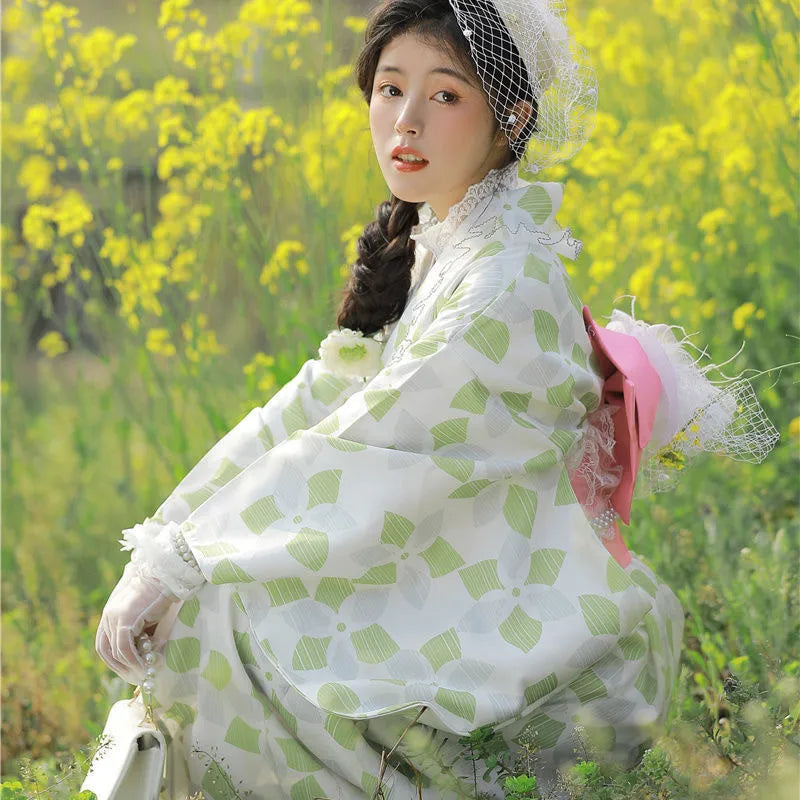 sitted woman wearing green lace kimono