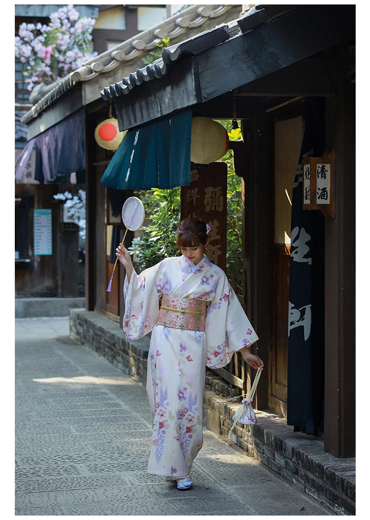 woman enjoying white floral kimono robe