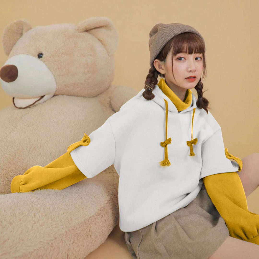 woman wearing yellow kawaii bear hoodie