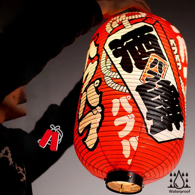 man holding japanese lantern red