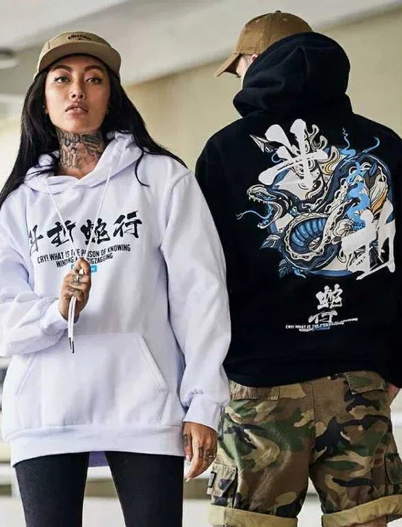 woman and woman wearing hoodie with dragon