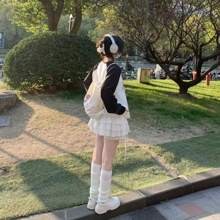 japanese woman in streeet wearing kawaii cat hoodie