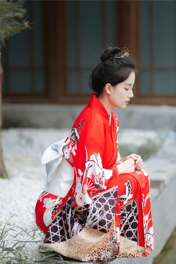 sitted woman with kimono robe red