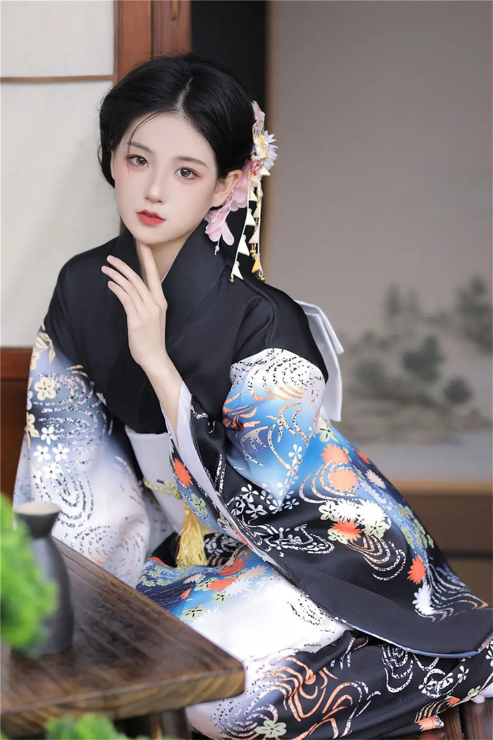 sitted woman with a  black japanese kimono robe