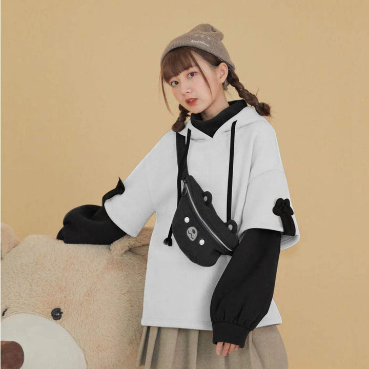 woman wearing black kawaii bear hoodie