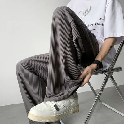 man-wearing-gray-japanese-pleated-pants