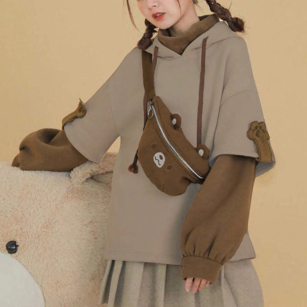 woman wearing brown kawaii bear hoodie