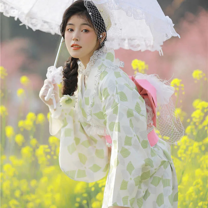 woman with an umbrella wearing a green lace kimono