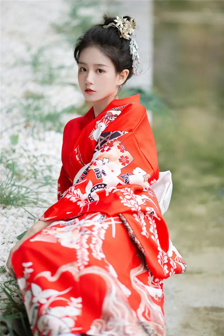 shy woman wearing kimono robe red