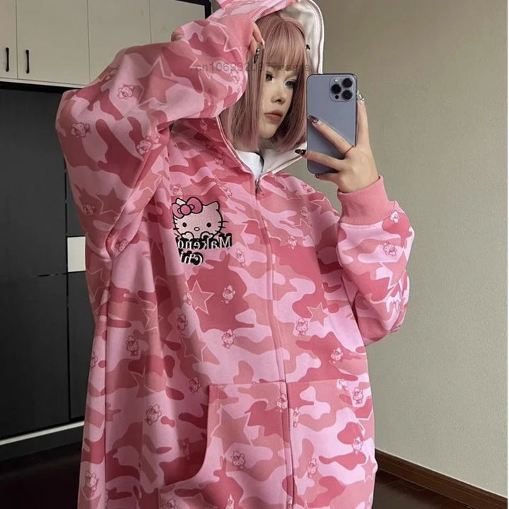 japanese woman wearing pink hello kitty bape hoodie